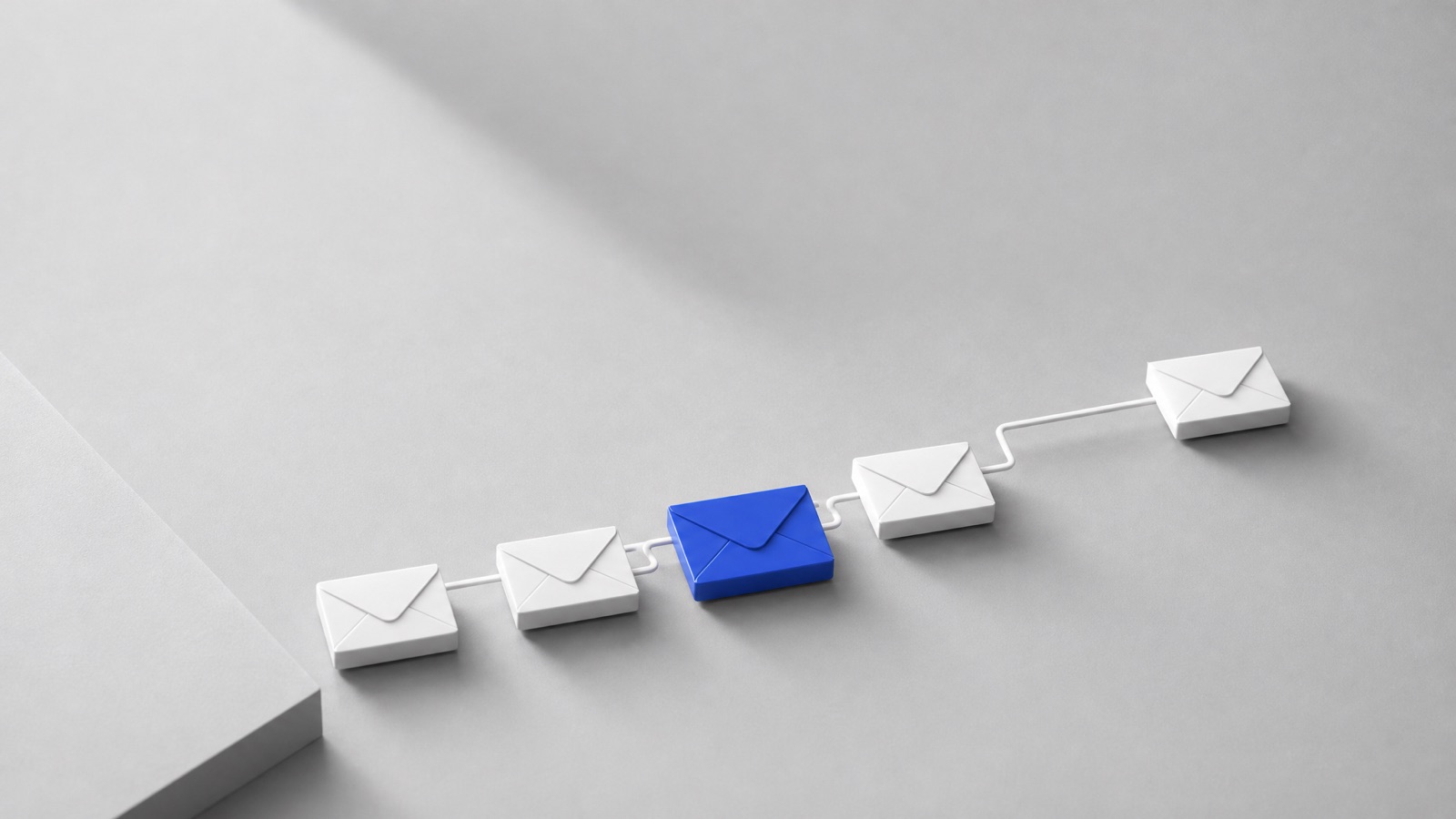 Five white envelope tiles linked in a rising line on grey, the third in cobalt blue, like a cold email follow-up sequence