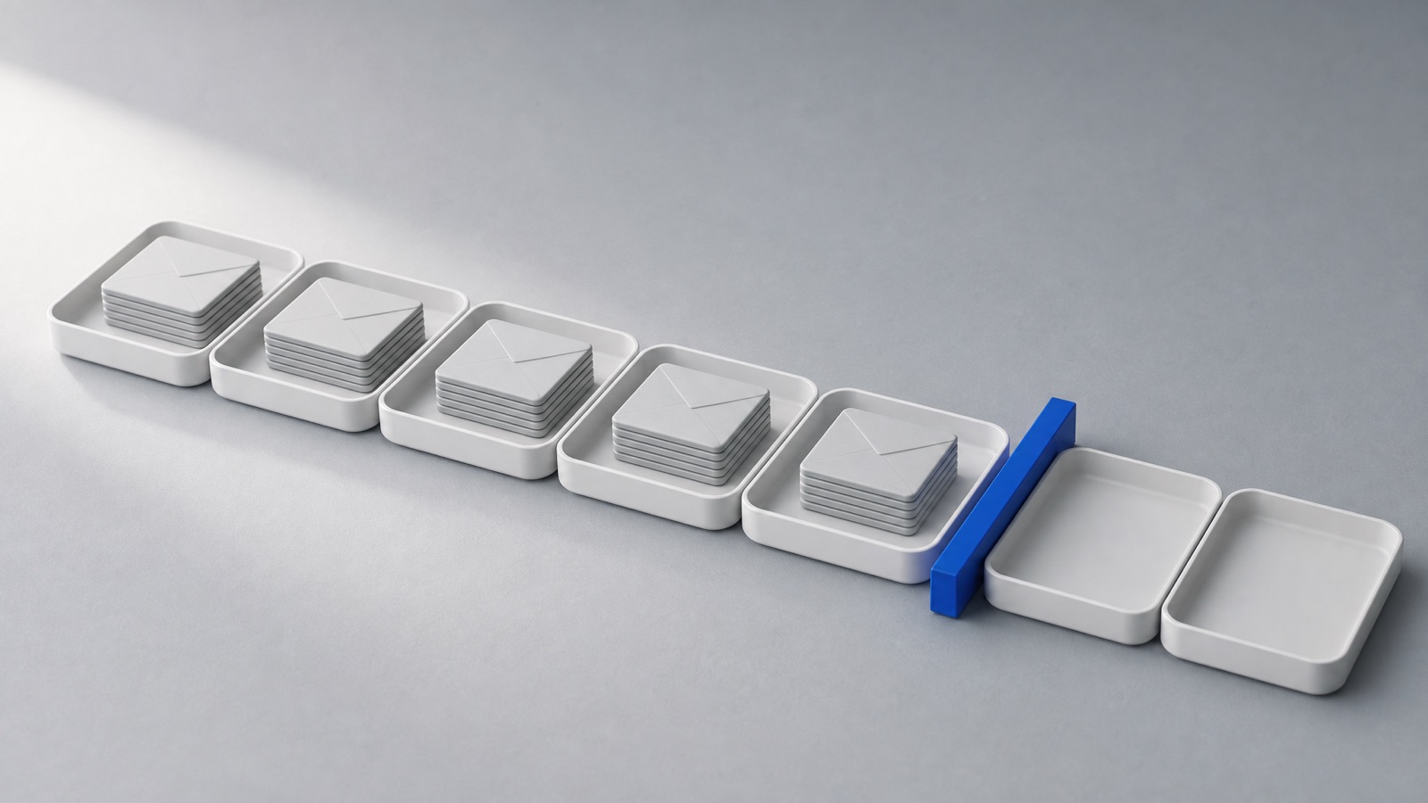 Seven white trays in a row like the days of a week, five holding stacks of message tiles and two empty behind a cobalt blue gate bar